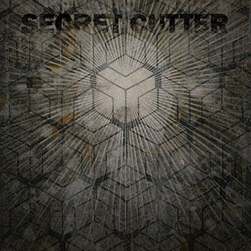 The alt text for the image is: "Vinyl album cover with geometric pattern and 'SECRET CUTTER' text."