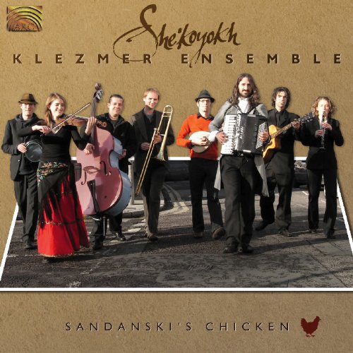 CD cover featuring a group of musicians holding various instruments on a stone surface.