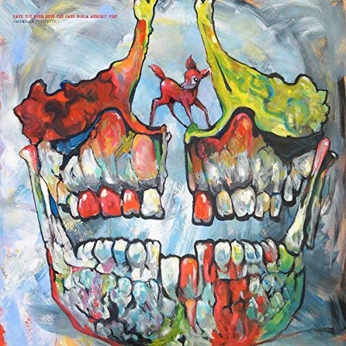 "Album cover featuring a colorful, abstract painting of a skull with a small red creature."