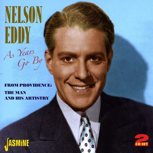 CD cover featuring Nelson Eddy, smiling man in suit against blue background.
