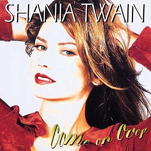 Shania Twain's album cover featuring her portrait, wearing red, with flowing brown hair.
