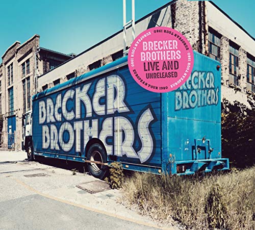 "Album cover with blue truck and 'Brecker Brothers' text, pink sticker, and industrial background."