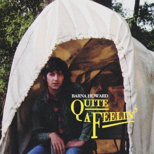 "Album cover with a man sitting inside a tent, titled 'Quite A Feelin'".