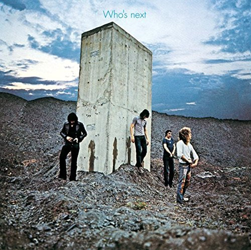The Who's album cover featuring four men standing near a concrete pillar outdoors.