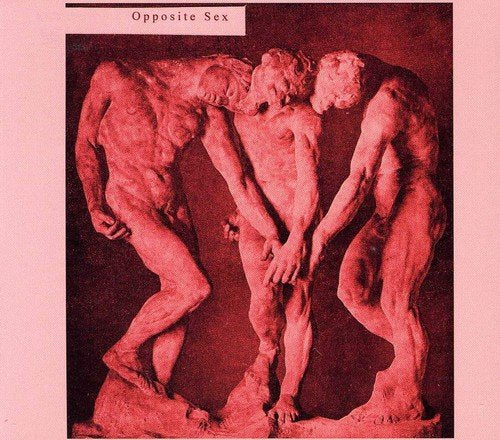 "Album cover with a red-toned image of three male statues, pink border."
