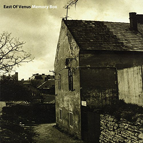 "Album cover: sepia-toned image of a weathered building with a tiled roof."