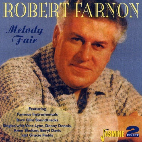 "CD cover with a man in a speckled shirt against a blue background."