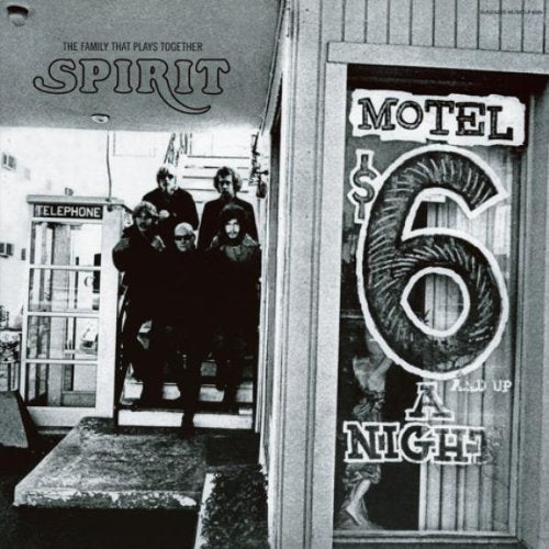 "Black and white vinyl record cover featuring a band outside a motel."