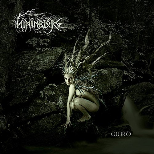 Album cover with a nude figure surrounded by branches in a dark forest.