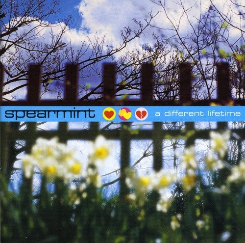 Album cover with flowers, wooden fence, and blue sky, featuring "Spearmint" and "a different lifetime".