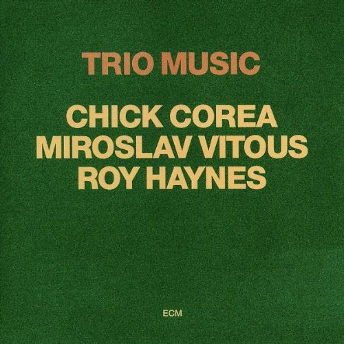 Green album cover with orange text "Trio Music" and artist names, featuring Amazon logo.