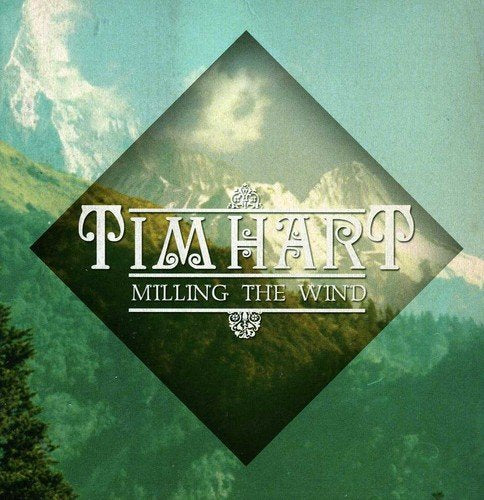 "CD cover with 'Tim Hart' and 'Milling the Wind' text over a mountain landscape."