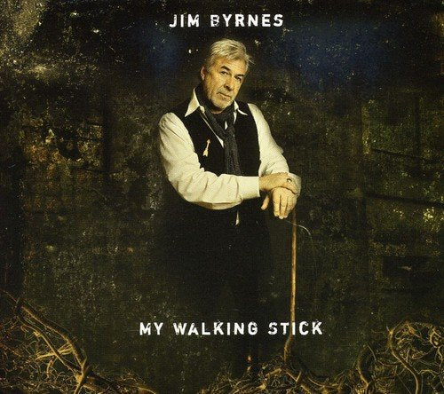 "Album cover featuring a man with a cane in a dark, grungy setting."