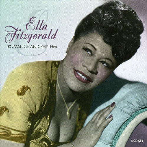 "Ella Fitzgerald smiling, wearing a gold dress, on a CD album cover."