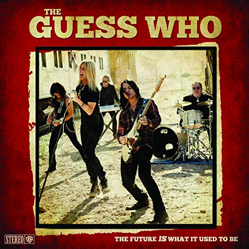 "Album cover with a band performing on a sandy surface, red background."