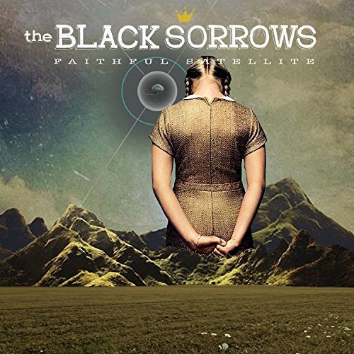 "Album cover featuring a woman standing in front of mountains under a green sky."