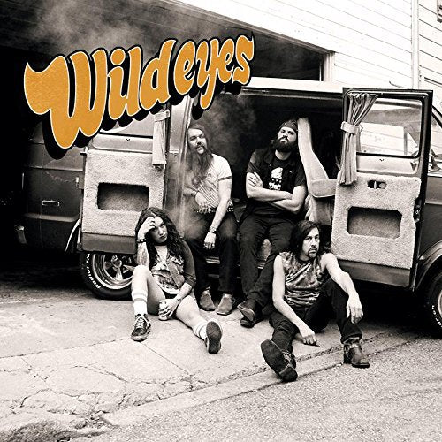 "Album cover with four men lounging around a van, 'Wildeyes' in orange text."