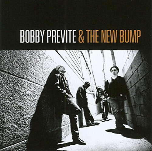 "CD album cover with three men in a dark alleyway, black and white photo."