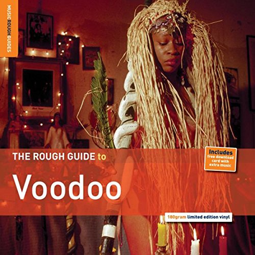 "Album cover with a person in a ritual setting, surrounded by candles and adorned with long hair."