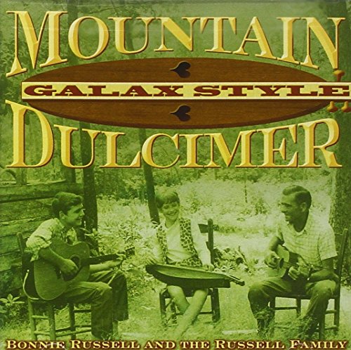 "CD cover with three people playing dulcimers outdoors, green-toned image."