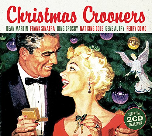 "Christmas album cover featuring a man and woman in front of a Christmas tree."