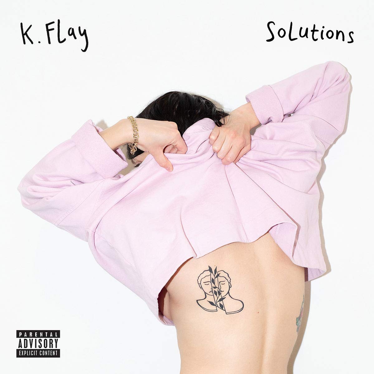 "Album cover featuring a woman with a tattoo on her lower back."