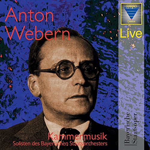 CD cover featuring a man in a suit and glasses against a blue background.