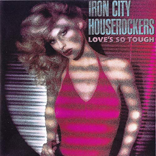 Album cover with a woman in pink top and blonde hair, band name and title.