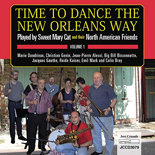 Album cover: group of men with instruments outside a brick building, purple text box.