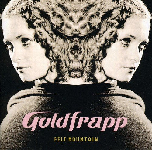 "Album cover with mirrored woman's face and 'Goldfrapp Felt Mountain' text on black background."