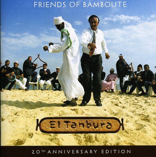"CD cover with two men dancing on sand, surrounded by seated musicians."