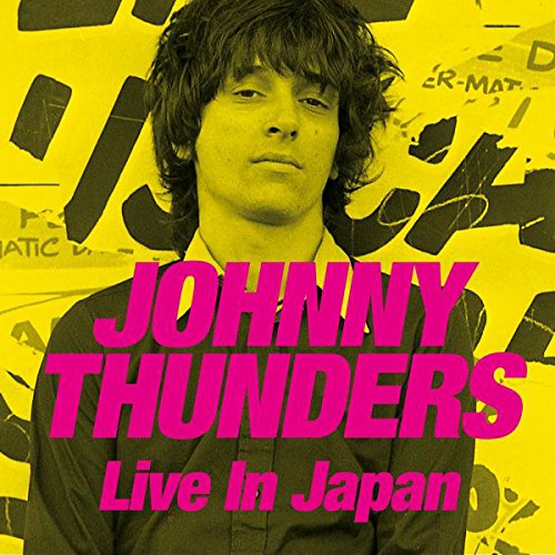 Album cover with a man in a shirt, yellow background, and pink text overlay.