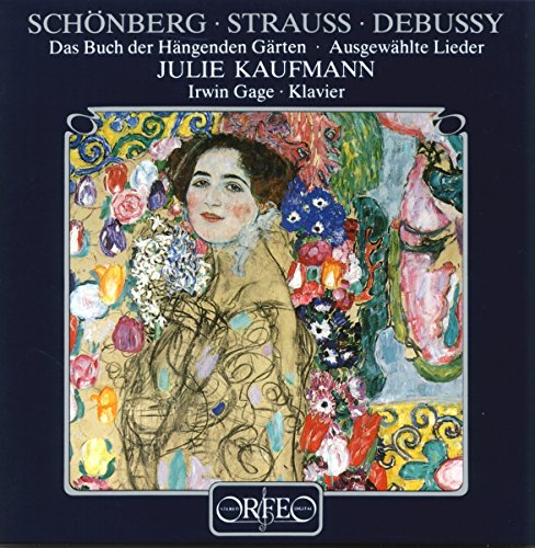 The image is a CD cover with a dark blue background and a central painting. For accessibility purposes, a suitable alt text could be: "CD cover featuring a portrait surrounded by flowers."
