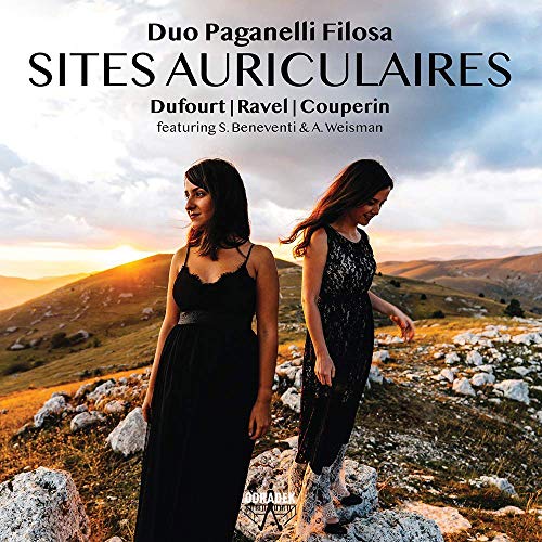 "CD cover featuring two women in black dresses standing on a rocky hillside."