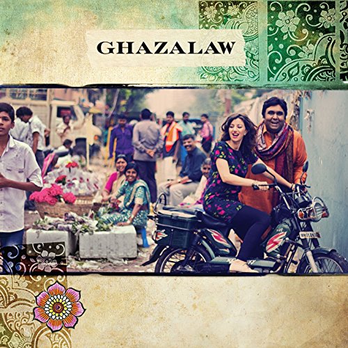 "CD cover with a couple on a motorcycle in a busy street scene."