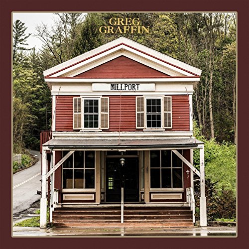 "Album cover featuring a red two-story building with 'Millport' sign, surrounded by trees."