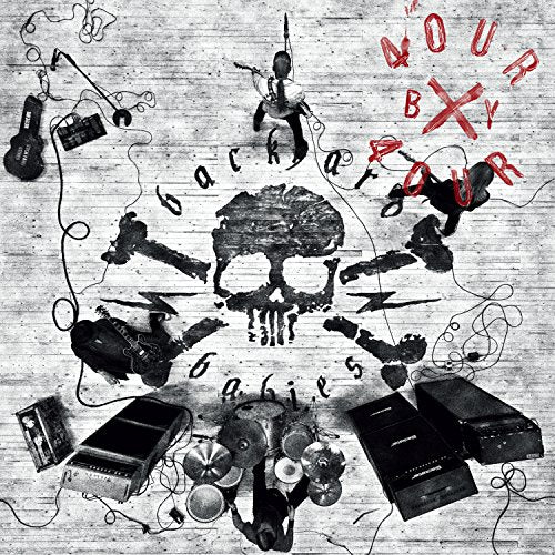 "Album cover with skull, instruments, and 'Backyard Babies' text on a brick background."