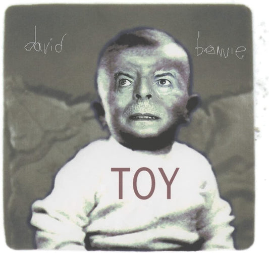 Album cover featuring a baby in a white shirt with "TOY" printed on it.