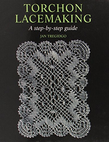 Book cover with white lace on a black background, titled "Torchon Lacemaking".