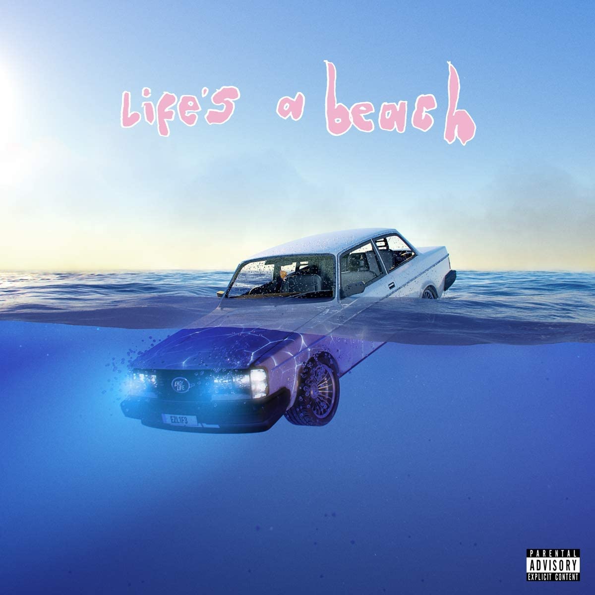 "Album cover with a car half-submerged in water, 'Life's a beach' text above."