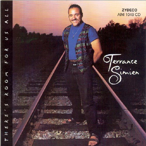 "CD cover featuring a man standing on train tracks with trees in the background."