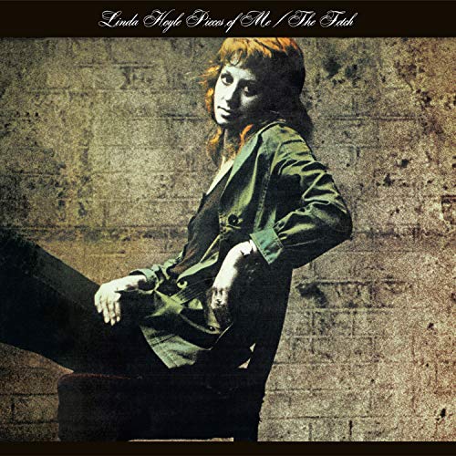 Linda Hoyle album cover featuring a woman sitting against a stone wall.