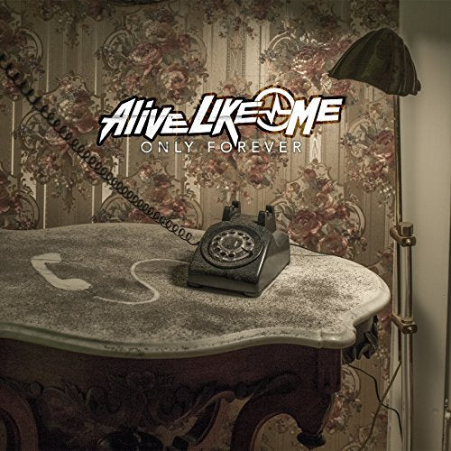 "Album cover with dusty phone on table, floral wallpaper, and lamp."