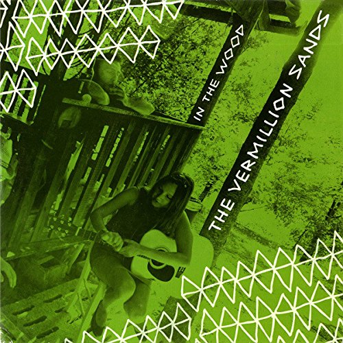 A green-toned vinyl record cover featuring a person sitting on a wooden structure.