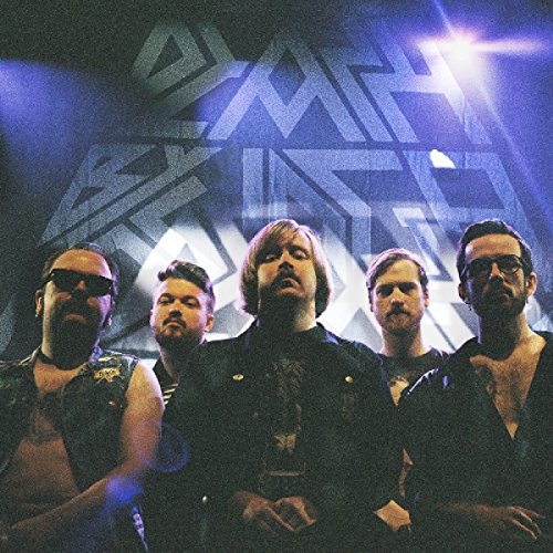 "Album cover featuring a band of five men standing together under stage lights."