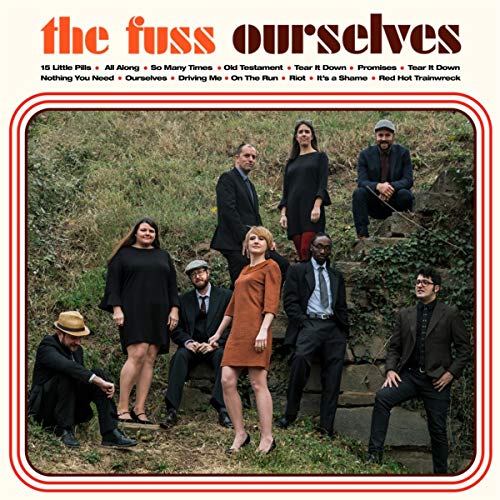 Album cover with a group of people posing on stone steps outdoors.
