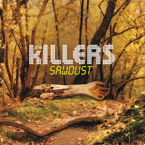 Album cover for "Sawdust" by The Killers, featuring a severed arm in a forest.