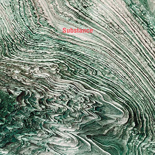 The image shows a vinyl record cover with a marbled green and white design. For accessibility purposes, a suitable alt text could be: "Vinyl record cover with green and white marbled pattern and red text."