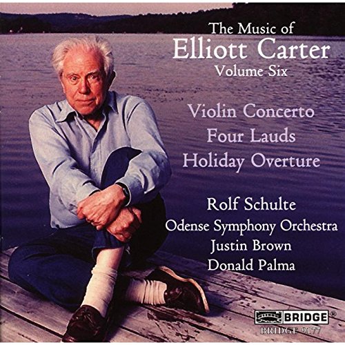 CD cover featuring a man sitting on a dock by a lake.