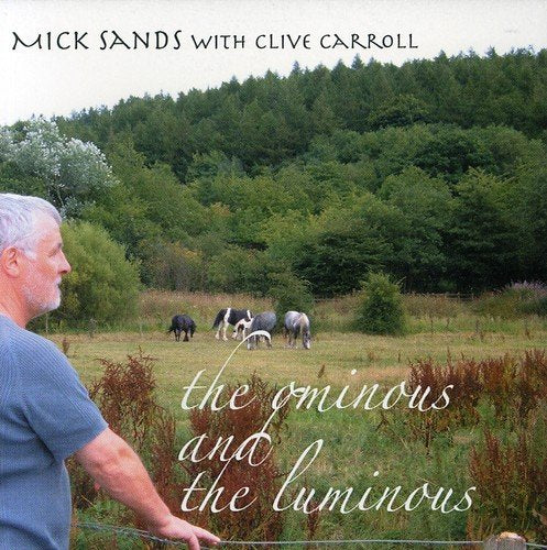 Album cover with a man standing by a fence, horses grazing in the background.